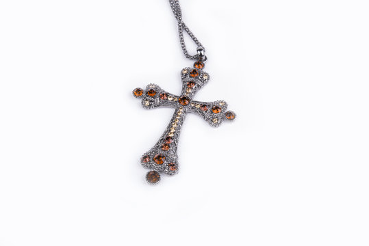 A beautiful cross necklace in a studio (background, wallpaper)