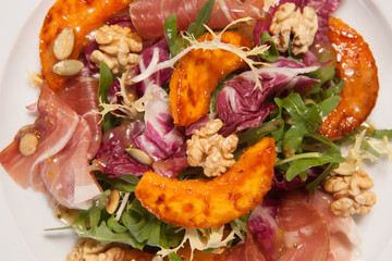 Hot salad with vegetables and nuts