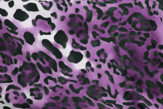 Beautiful purple animal print leopard background / wallpaper