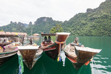 Fototapeta na wymiar Boats on the lake Dam Ratchaprapa SuratThani thailand