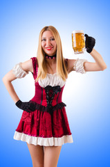 Young waitress with beer on white