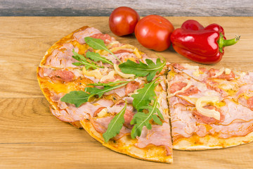 Delicious pizza with fresh herbs, tomatos and pepper