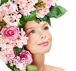 fashion model with large hairstyle and flowers in her hair.