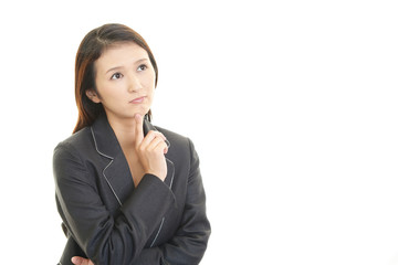 疲れた表情のOL