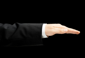 Obraz premium Caucasian male hand in a business suit isolated