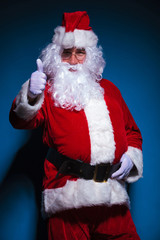 Santa Claus showing the thumbs up gesture