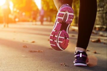 Fitness Girl running at sunset