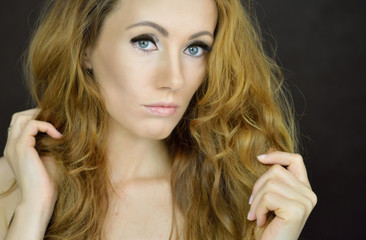 Beautiful woman with curly hair © Bydlinska