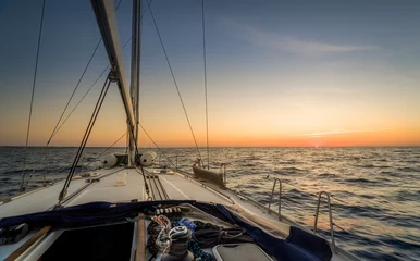 Wandaufkleber Sailing to sunset © AlexanderNikiforov