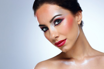 Portrait of a charming woman with skin care over blue background