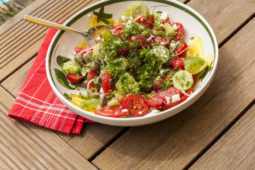 Bowl of Marinated Greek Salad with Red Napkin