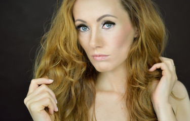 Beautiful woman with curly hair © Bydlinska