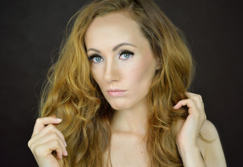 Beautiful woman with curly hair © Bydlinska