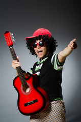 Fototapeta premium man with funny haircut and guitar