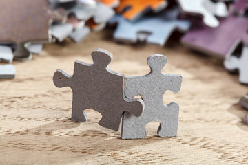 Two jigsaw puzzle pieces on table
