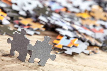 Two Jigsaw Puzzle Pieces on Table