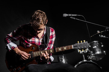 Man with guitar during concert