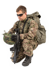 Soldier with rifle on a white background