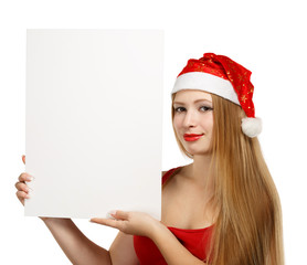 Young woman in santa claus hat with christmas card