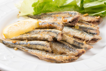 Fried anchovies with salad