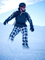 Fototapeta na wymiar Male snowboarder with helmet in the Austrian Alps
