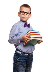 Young child holding stack of books 