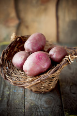 raw potatoes in a basket