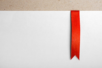 Red bookmark on empty sheet of paper