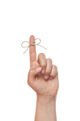 bow on finger, isolated on white background