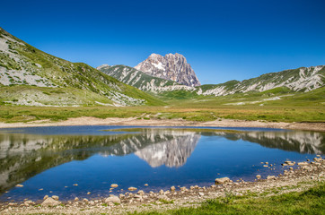 Naklejka na ściany i meble Gran Sasso mountain lake reflection, Campo Imperatore, Italy