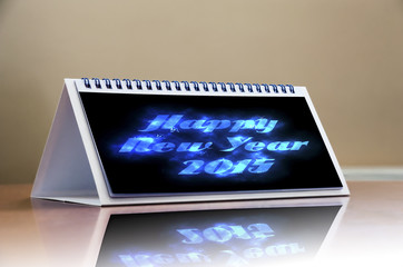 Happy New Year 2015 celebration concept, calendar on wooden tabl