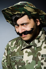 Funny soldier in military concept
