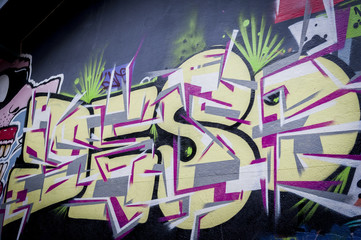 Naklejka premium Mur de graffiti lettres
