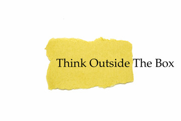 Think outside the box text on brown paper