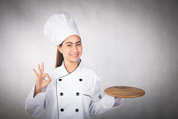 Woman chef showing and presenting