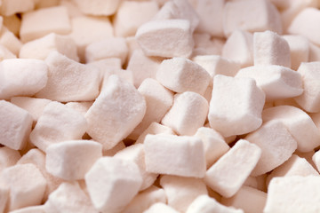 Tender white marshmallow pieces background