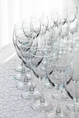 Zelfklevend Fotobehang Line of empty wine glasses © lena_serditova