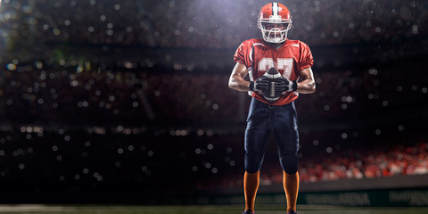 American football player in action on the stadium