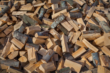 firewood background - chopped firewood on a stack
