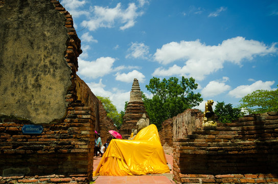 statue at reclining buddha in Wat Puthai Sawam, Thailand