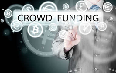 Businessman pushes virtual crowd funding button