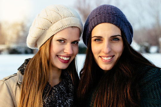Girlfriends outside in winter portrait