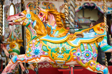 Fototapeta na wymiar Beautiful decorated horse on a merry-go-round