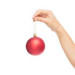 close up of woman in sweater with christmas ball