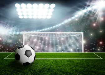 Soccer ball on green stadium arena