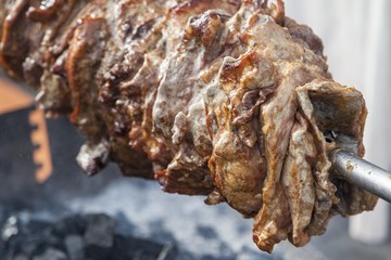 Detail of grilled meat prepared outdoors