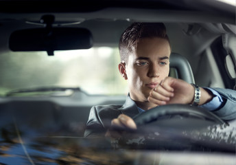 attractive man driving his car