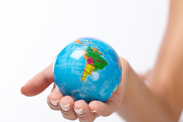woman's hand with globe