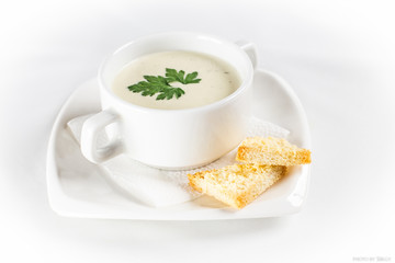white cream soup with bread
