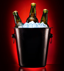 Beer bottles in ice bucket